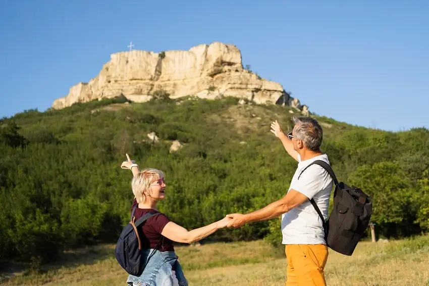 Senior couple enjoying a guided mountain hiking adventure in Tanzania